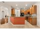 Open kitchen featuring wood cabinets, granite countertops, and stainless steel appliances at 11316 Rapallo Ln, Windermere, FL 34786