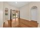Bright, open living area features hardwood floors and access to the outdoor lanai at 11316 Rapallo Ln, Windermere, FL 34786