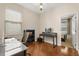 Functional home office with a desk, chair, shelving, and hardwood floors at 11316 Rapallo Ln, Windermere, FL 34786