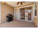 This screened patio offers a grill and sliding glass doors to the interior at 11316 Rapallo Ln, Windermere, FL 34786