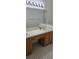 Bathroom features double sinks with lots of counter space and a large mirror at 11818 Sophia Ln, Orlando, FL 32821