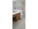 Compact bathroom with vanity, sink, and shower featuring a modern design at 11818 Sophia Ln, Orlando, FL 32821