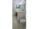 Bathroom with a double sink vanity and toilet featuring tile flooring at 11818 Sophia Ln, Orlando, FL 32821