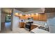 Bright kitchen with ample storage, sleek appliances and open to the dining area at 11818 Sophia Ln, Orlando, FL 32821