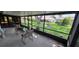 Screened-in lanai featuring comfortable seating and a view of the lush backyard at 11818 Sophia Ln, Orlando, FL 32821