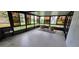 Enclosed lanai providing a serene space to relax and unwind with comfortable seating at 11818 Sophia Ln, Orlando, FL 32821