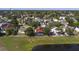 Wide aerial shot of a neighborhood featuring diverse home styles and scenic water views at 1254 Shelter Rock Rd, Orlando, FL 32835