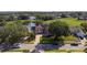 Aerial view of a home, landscaping, and lake in a beautiful neighborhood at 1254 Shelter Rock Rd, Orlando, FL 32835