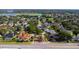 Aerial view of neighborhood, nearby ponds and streets with palm tree islands at 1254 Shelter Rock Rd, Orlando, FL 32835