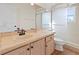 Bright bathroom with a granite-topped vanity and large glass shower at 1254 Shelter Rock Rd, Orlando, FL 32835