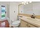 Bathroom featuring a tile floor, toilet, and a vanity with a large mirror at 1254 Shelter Rock Rd, Orlando, FL 32835