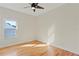 Bedroom featuring wood floors, neutral walls, and a bright window at 1254 Shelter Rock Rd, Orlando, FL 32835