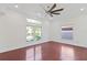Open bedroom with hardwood floors, a large window, and ample natural light at 1254 Shelter Rock Rd, Orlando, FL 32835