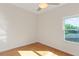 Cozy bedroom featuring wood floors and a bright window at 1254 Shelter Rock Rd, Orlando, FL 32835
