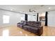 Spacious bonus room with hardwood floors, a ceiling fan, recessed lighting, and a large screen at 1254 Shelter Rock Rd, Orlando, FL 32835