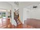 Elegant foyer with decorative staircase and hardwood floors at 1254 Shelter Rock Rd, Orlando, FL 32835