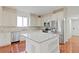 Modern kitchen with stainless steel appliances, white cabinets, and a large center island at 1254 Shelter Rock Rd, Orlando, FL 32835