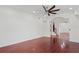 Open living room with hardwood floors, staircase, and a ceiling fan at 1254 Shelter Rock Rd, Orlando, FL 32835