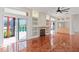 Bright living room with hardwood floors, fireplace, and sliding doors to the pool at 1254 Shelter Rock Rd, Orlando, FL 32835