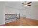 A spacious loft featuring gleaming wood floors and modern ceiling fan at 1254 Shelter Rock Rd, Orlando, FL 32835