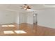 Spacious primary bedroom with wood floors, closet, and en-suite bathroom at 1254 Shelter Rock Rd, Orlando, FL 32835