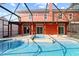 Enclosed pool with spa and covered seating area, connected directly to the home at 1254 Shelter Rock Rd, Orlando, FL 32835