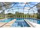 Relaxing screened-in pool with views of the backyard and surrounding landscape at 1254 Shelter Rock Rd, Orlando, FL 32835