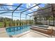 Enclosed pool and spa with a clear view of the backyard at 1254 Shelter Rock Rd, Orlando, FL 32835