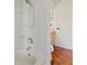 Shower featuring white tile walls and a showerhead at 1254 Shelter Rock Rd, Orlando, FL 32835