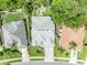 Aerial view of a home showcasing its roof, surrounding landscaping, driveway, and neighborhood at 12618 Lakebrook Dr, Orlando, FL 32828