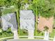 Aerial view of a home showcasing its roof, surrounding landscaping, driveway, and neighborhood at 12618 Lakebrook Dr, Orlando, FL 32828