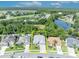 Aerial view of a home highlighting its location, landscaping, and proximity to a pond at 12618 Lakebrook Dr, Orlando, FL 32828