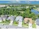 Aerial view of a home highlighting its location, landscaping, and proximity to a pond at 12618 Lakebrook Dr, Orlando, FL 32828