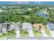 Beautiful aerial view of homes with well-maintained lawns and a serene pond at 12618 Lakebrook Dr, Orlando, FL 32828