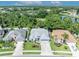 Aerial view of a home highlighting its location, landscaping, and proximity to a pond at 12618 Lakebrook Dr, Orlando, FL 32828
