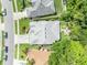 Aerial view of a home showcasing its roof, surrounding landscaping, driveway, and neighborhood at 12618 Lakebrook Dr, Orlando, FL 32828