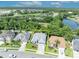 Aerial view of a home highlighting its location, landscaping, and proximity to a pond at 12618 Lakebrook Dr, Orlando, FL 32828