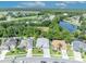 Aerial view of a home highlighting its location, landscaping, and proximity to a pond at 12618 Lakebrook Dr, Orlando, FL 32828