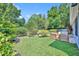 Expansive backyard with mature trees, a patio area, and ample space for outdoor activities and relaxation at 12618 Lakebrook Dr, Orlando, FL 32828