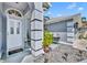 Inviting front entrance with a welcoming doormat, potted plants, and decorative gravel landscaping at 12618 Lakebrook Dr, Orlando, FL 32828
