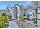 Cozy covered front porch with seating area and manicured landscaping offers curb appeal at 12618 Lakebrook Dr, Orlando, FL 32828