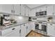 Well-equipped kitchen features granite countertops, stainless oven, and crisp white subway tile backsplash at 12618 Lakebrook Dr, Orlando, FL 32828
