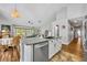 Lovely kitchen with granite countertops, stainless dishwasher, and view to the living and dining areas at 12618 Lakebrook Dr, Orlando, FL 32828