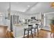 Beautiful kitchen with white cabinets, granite countertops, stainless appliances, and breakfast bar seating at 12618 Lakebrook Dr, Orlando, FL 32828