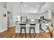 Bright kitchen boasts white cabinets, stainless appliances, granite countertops, and a convenient breakfast bar at 12618 Lakebrook Dr, Orlando, FL 32828