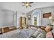 Bright living room with wood floors, a large window, and comfortable seating, perfect for relaxing at 12618 Lakebrook Dr, Orlando, FL 32828