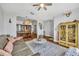 Bright living room with wood floors, a neutral color palette, and open access to the dining area at 12618 Lakebrook Dr, Orlando, FL 32828