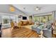 Spacious living room features vaulted ceilings, stylish decor, and sliding glass doors to the outdoor area at 12618 Lakebrook Dr, Orlando, FL 32828