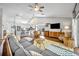 Spacious living room featuring an open layout with a modern kitchen and comfortable seating at 12618 Lakebrook Dr, Orlando, FL 32828