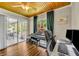 Home office with a view of the lanai, and outdoor seating at 12618 Lakebrook Dr, Orlando, FL 32828